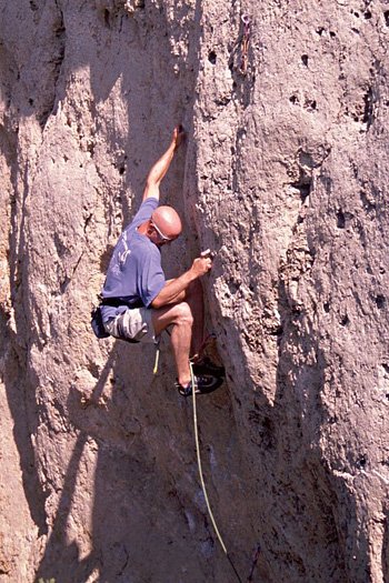 Keith McCallister focusing on the feet in sending the technical Pistols & Gri Gris, at Wild Iris, WY.