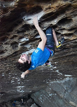 Jonathan Hörst employing strategic resting in order to maximize his climbing endurance at the Red River Gorge.