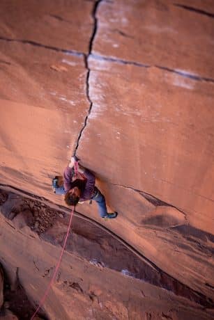 Adrian Vanoni on a previous ascent of Learning to Fly in Indian Creek.